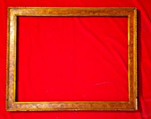 cornice in legno intagliato dorato e laccato a finta radica di noce. XIX° sec. luce cm.53x73 est.cm.67x84